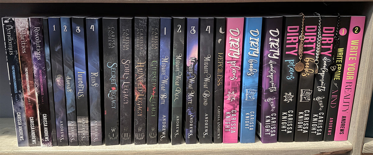 Row of Carissa Andrews, Carissa Knight, and Carissa L Andrews books on a shelf.